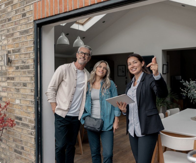 Real estate agent showing a home to prospective buyers