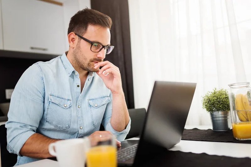 Person using AI tools on a laptop at home
